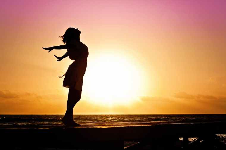 woman-happiness-sunrise-silhouette-40192.jpeg